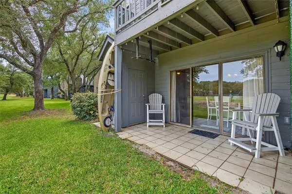 a view of a porch with chairs and backyard