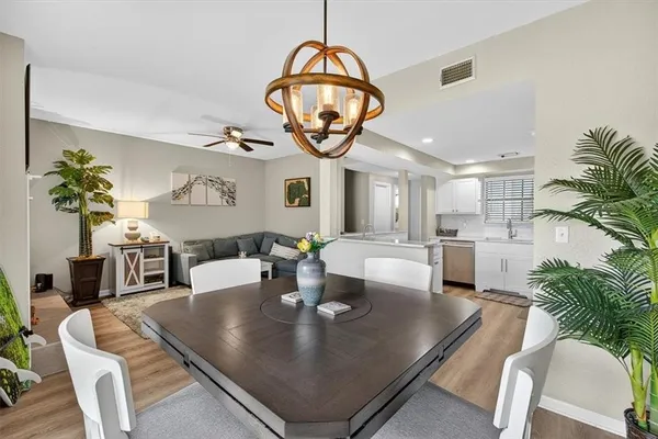 a bathroom with a granite countertop sink a toilet and a mirror