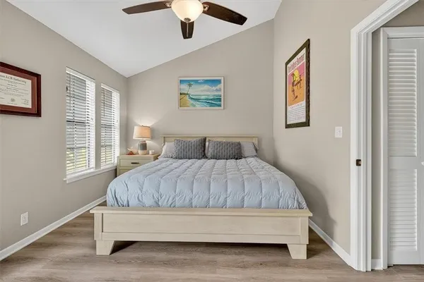 a bedroom with furniture and a flat screen tv