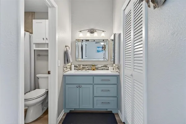 a bathroom with a shower and a toilet