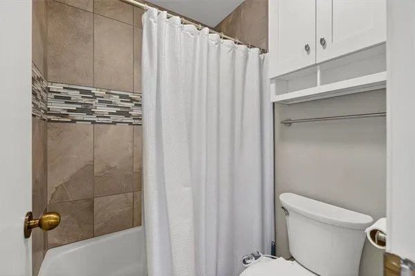a view of balcony with wooden floor and fence