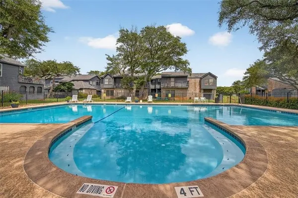 a view of a swimming pool with a patio