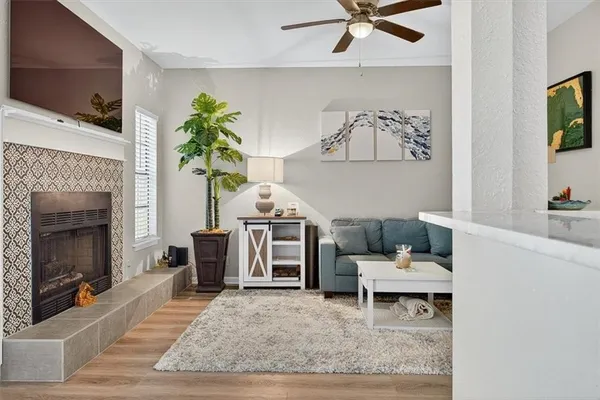 a living room with furniture and a fireplace