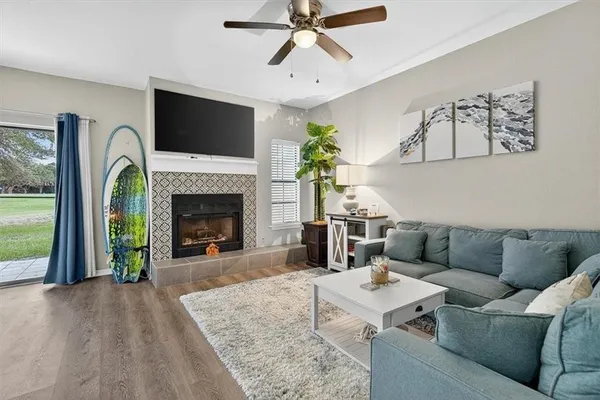 a living room with furniture and a fireplace