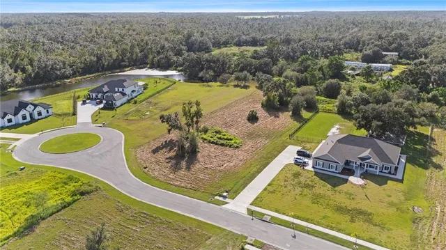 a view of a swimming pool with a bench in front of it