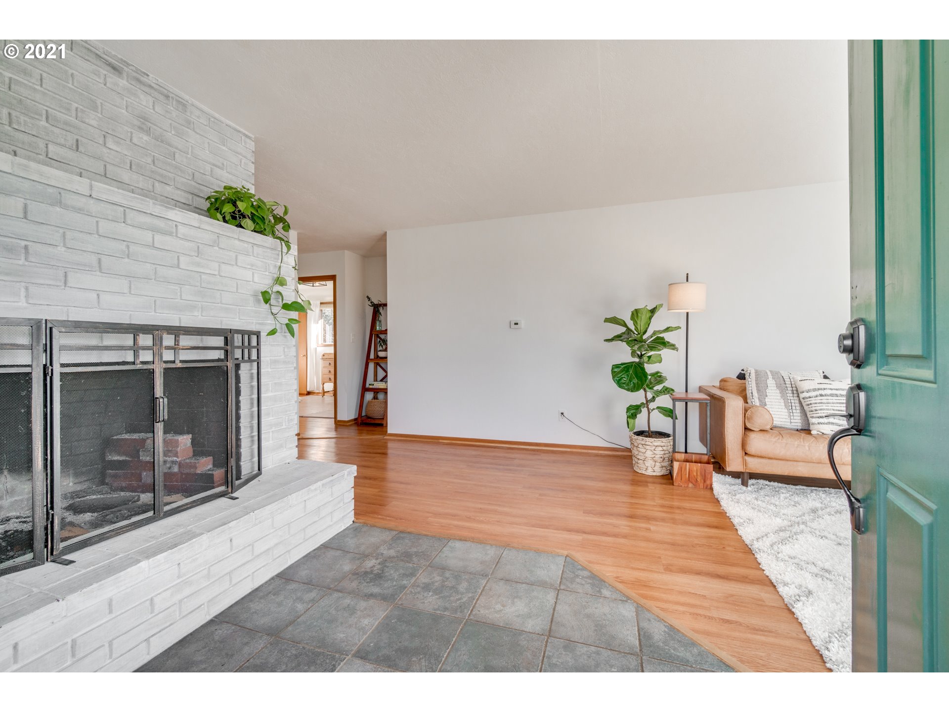 22422 South Schieffer Road Colton, OR 97017 - Photo 3 of 32 a view of a hallway with wooden floor and a fireplace