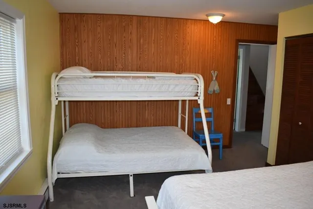 a bedroom with a bed and a table