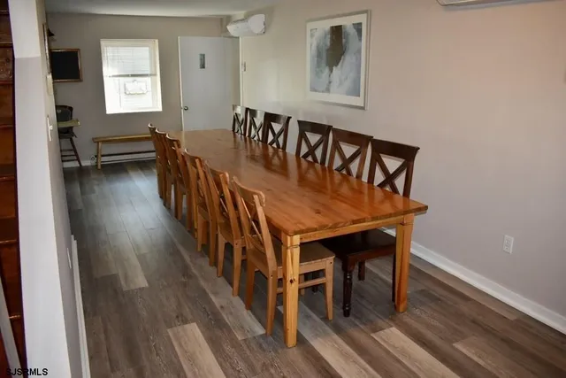 a view of a dining room with furniture and window