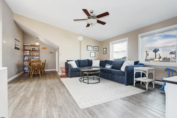 a living room with furniture and a table