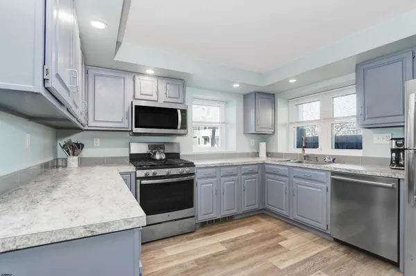 a living room with furniture and a rug