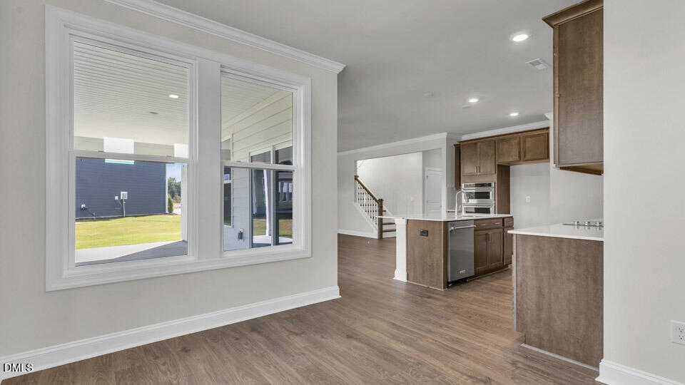 128 Gilmer Street Fuquay-Varina, NC 27526 - Photo 12 of 42 a view of kitchen with furniture and stainless steel appliances