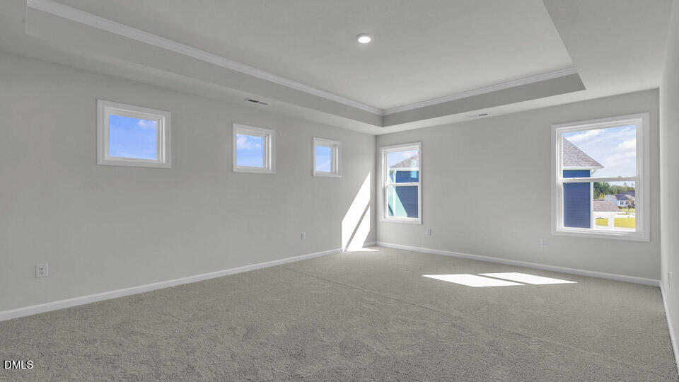 128 Gilmer Street Fuquay-Varina, NC 27526 - Photo 20 of 42 an empty room with windows