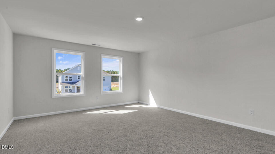 128 Gilmer Street Fuquay-Varina, NC 27526 - Photo 23 of 42 an empty room with windows