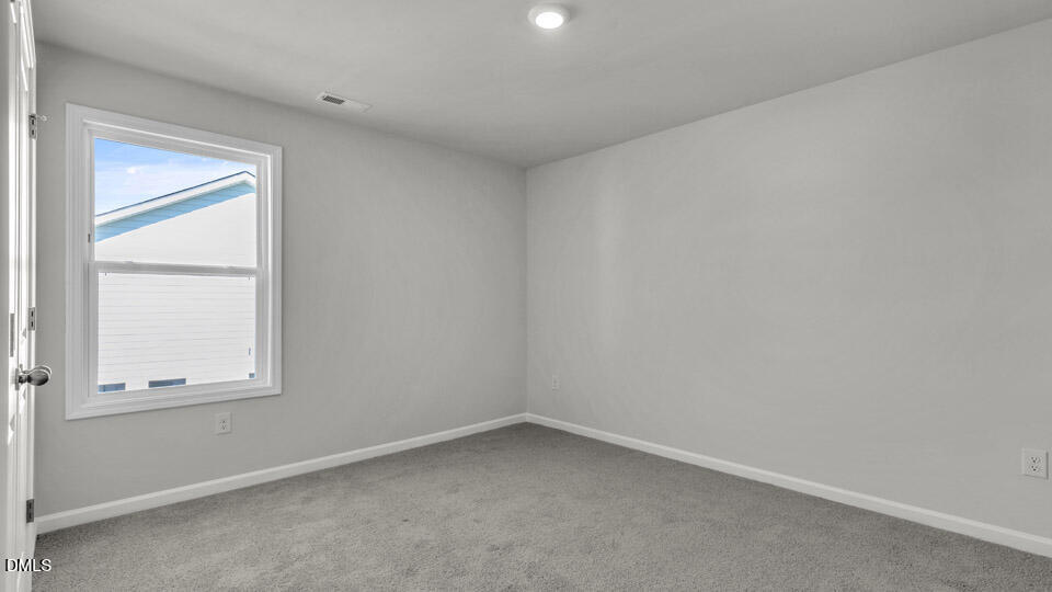 128 Gilmer Street Fuquay-Varina, NC 27526 - Photo 26 of 42 an empty room with a window