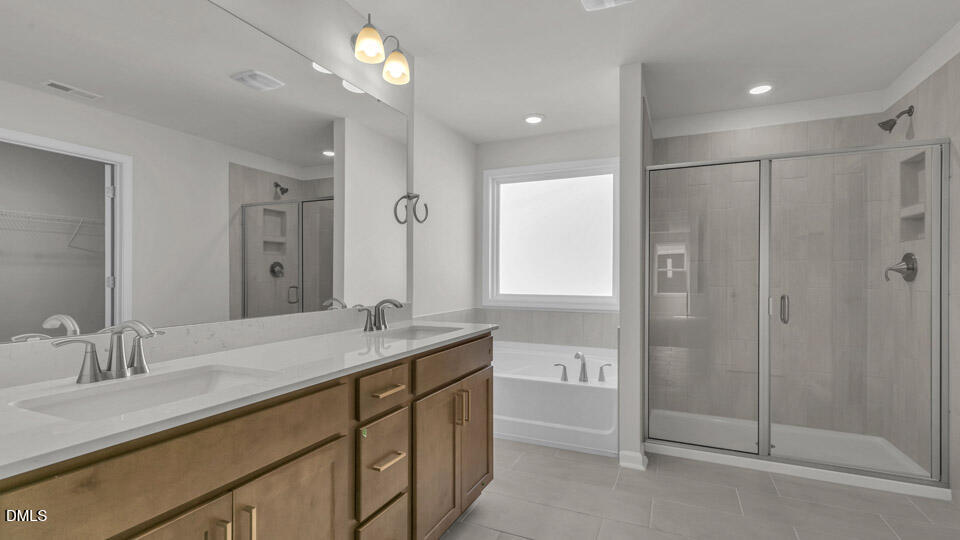 128 Gilmer Street Fuquay-Varina, NC 27526 - Photo 27 of 42 a bathroom with a granite countertop sink mirror and double