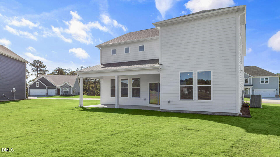128 Gilmer Street Fuquay-Varina, NC 27526 - Photo 34 of 42 a view of a house with garden