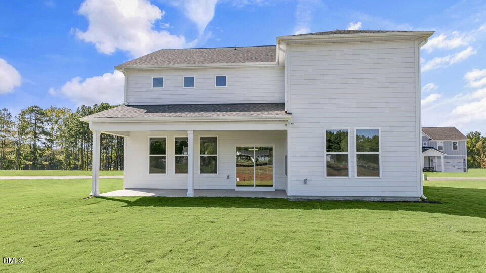 128 Gilmer Street Fuquay-Varina, NC 27526 - Photo 36 of 42 a view of a house with garden