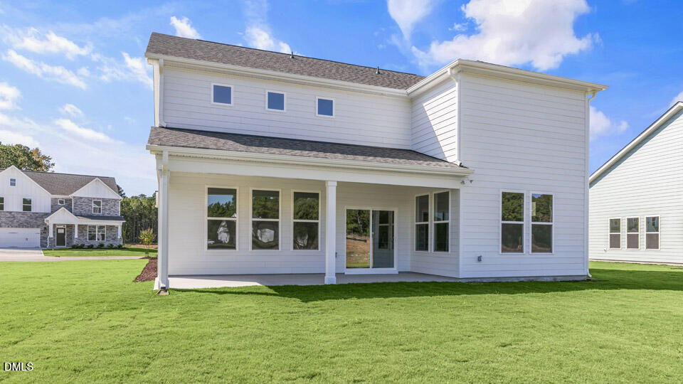 128 Gilmer Street Fuquay-Varina, NC 27526 - Photo 38 of 42 a view of a house with a yard
