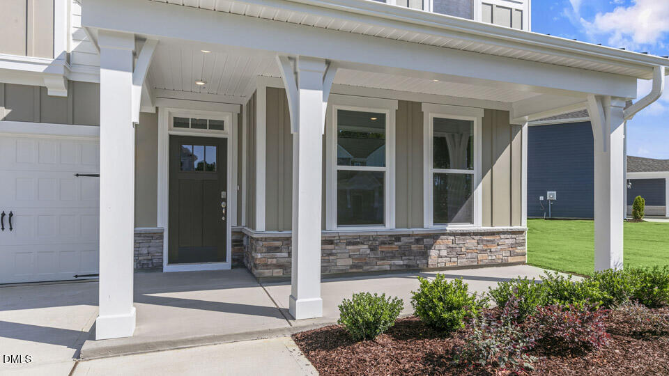 128 Gilmer Street Fuquay-Varina, NC 27526 - Photo 4 of 42 a front view of a house with a yard