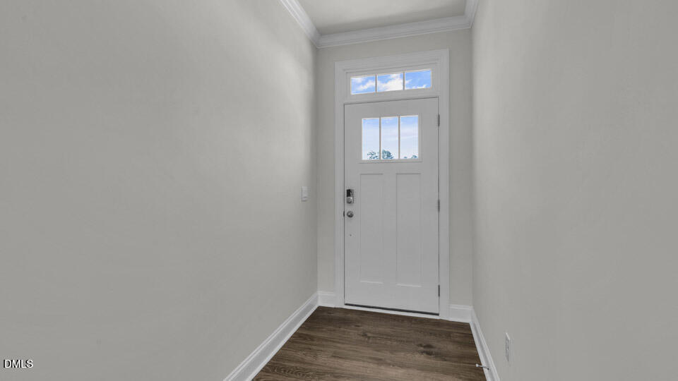 128 Gilmer Street Fuquay-Varina, NC 27526 - Photo 5 of 42 a view of an empty room and wooden floor