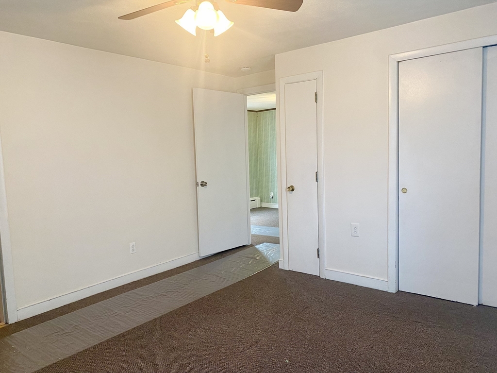 an empty room with a bathroom