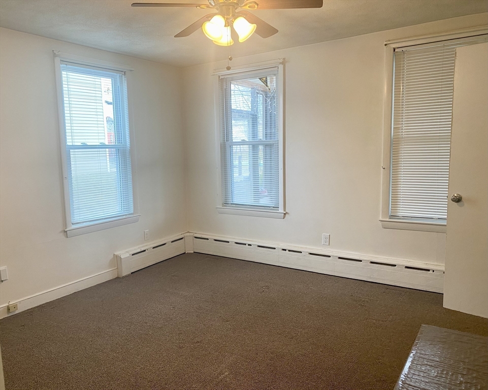 43 Glenwood Avenue, Unit 1 Boston, MA 02136 - Photo 2 of 11 an empty room with a window