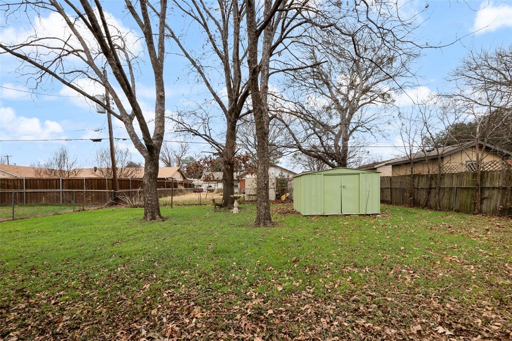 404 Vaden Avenue Everman, TX 76140 - Photo 15 of 16 a view of a park with large trees