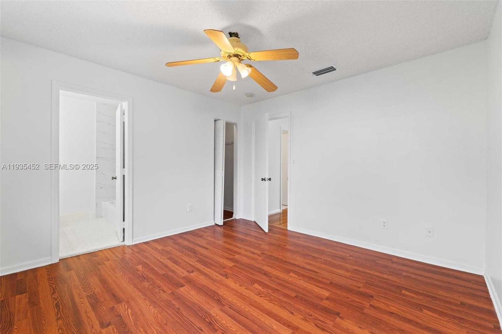 13925 Southwest 175th Terrace Miami, FL 33177 - Photo 16 of 20 a view of a big room with wooden floor