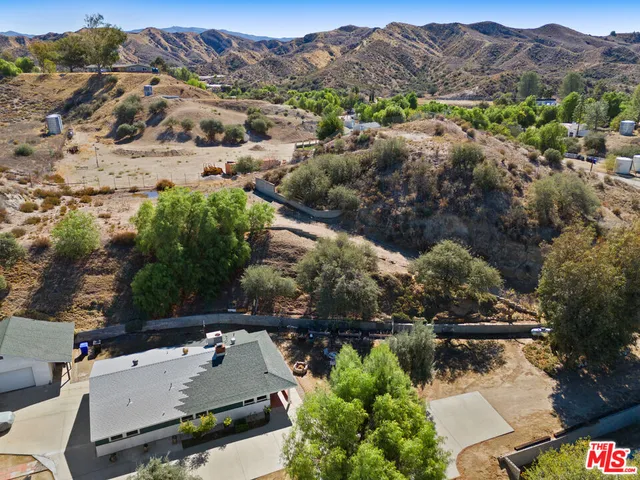 an aerial view of houses with a lake view