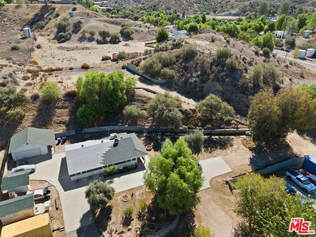 an aerial view of residential house with outdoor space