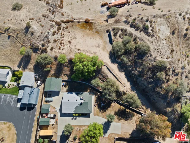 an aerial view of residential house with outdoor space
