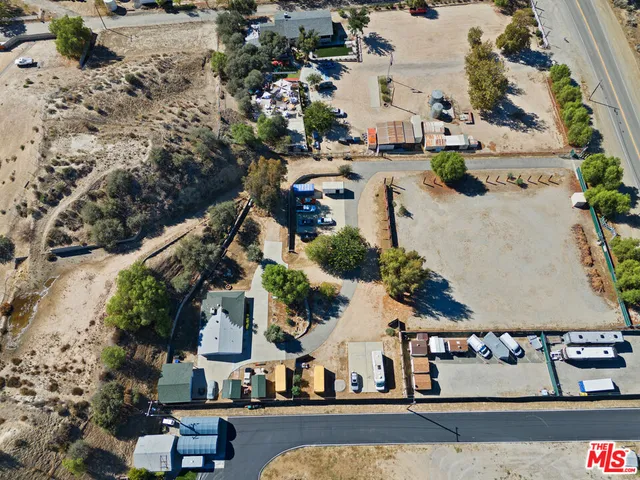 an aerial view of multiple houses with yard