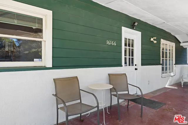 a outdoor view with a chair and table