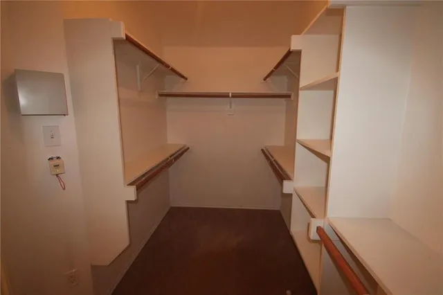 an empty room with windows and entrance