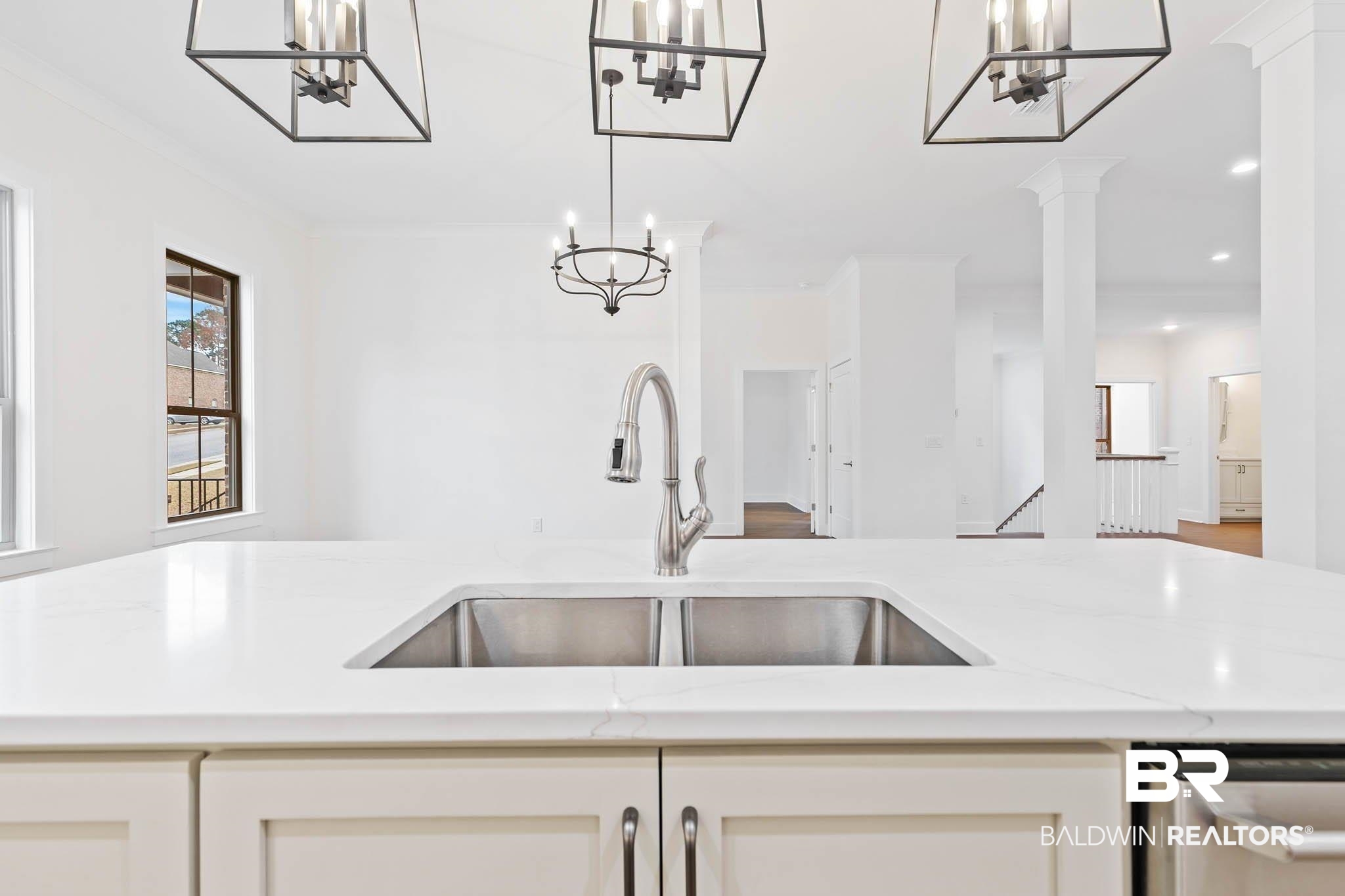 6656 Garrison Drive Daphne, AL 36527 - Photo 17 of 57 Kitchen with light stone counters, stainless steel dishwasher, hanging light fixtures, and crown molding