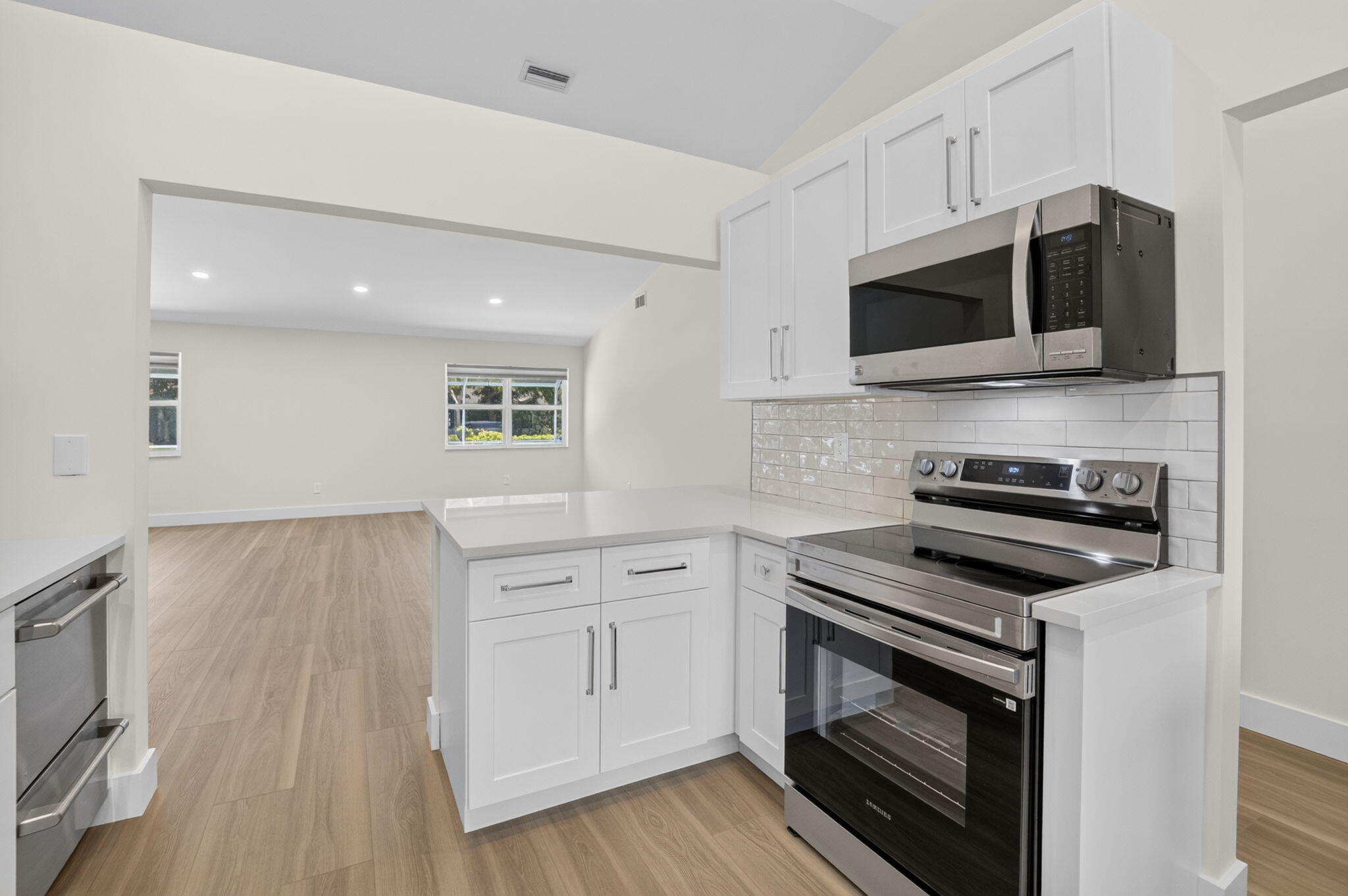 1378 Northwest 13th Court Boca Raton, FL 33486 - Photo 15 of 57 KITCHEN LOOKING INTO GREAT ROOM