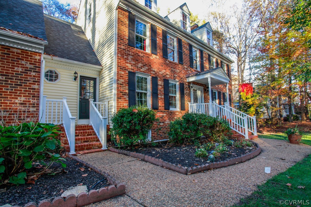 13900 Beechwood Point Road Midlothian, VA 23112 - Photo 32 of 34 a front view of a house with a garden