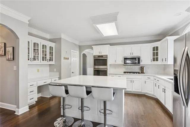 a view of a balcony with wooden floor and fence