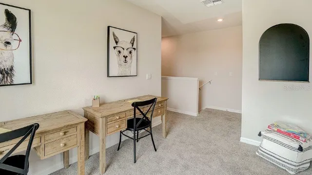 a view of a workspace with furniture