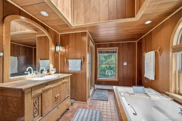 a bathroom with a double vanity sink and a mirror