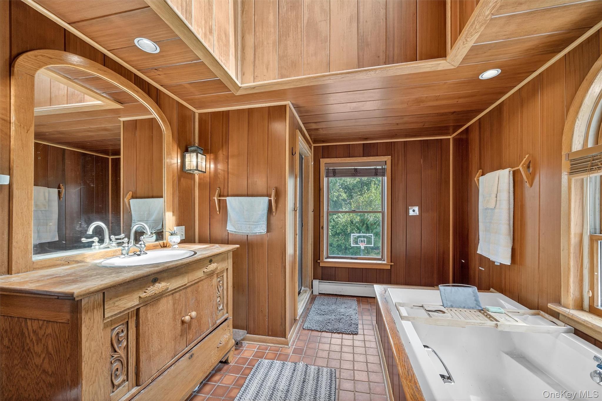 252 Round Hill Road Florida, NY 10921 - Photo 11 of 20 a bathroom with a double vanity sink and a mirror