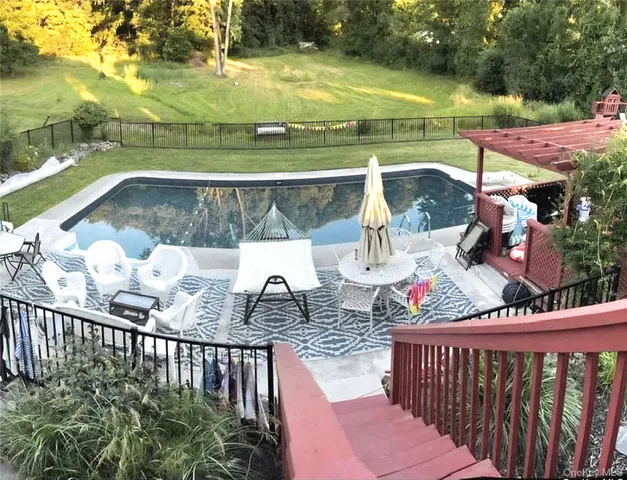 a view of a balcony with swimming pool