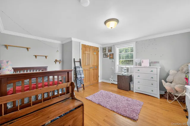 a bedroom with furniture and a window