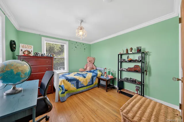 a bedroom with bed and a window