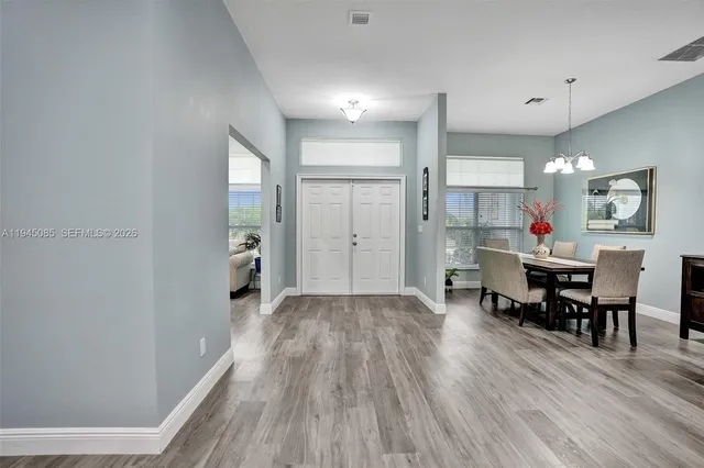 a view of a kitchen and dining room