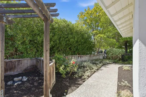 a front view of house with yard and outdoor seating