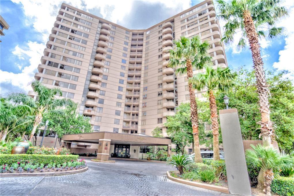 3525 Sage Road, Unit 403 Houston, TX 77056 - Photo 1 of 35 front view of a building with a garden