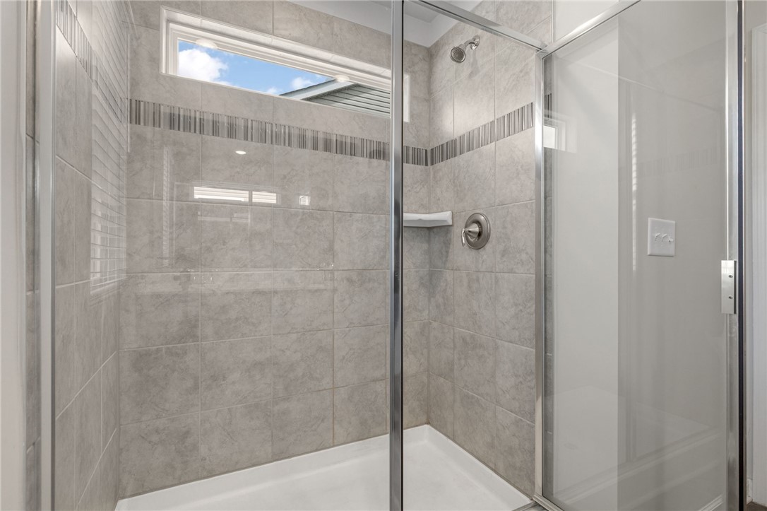 432 Bee Cv Way Pendleton, SC 29670 - Photo 21 of 39 This modern shower offers privacy and natural light through its thoughtfully placed window.
