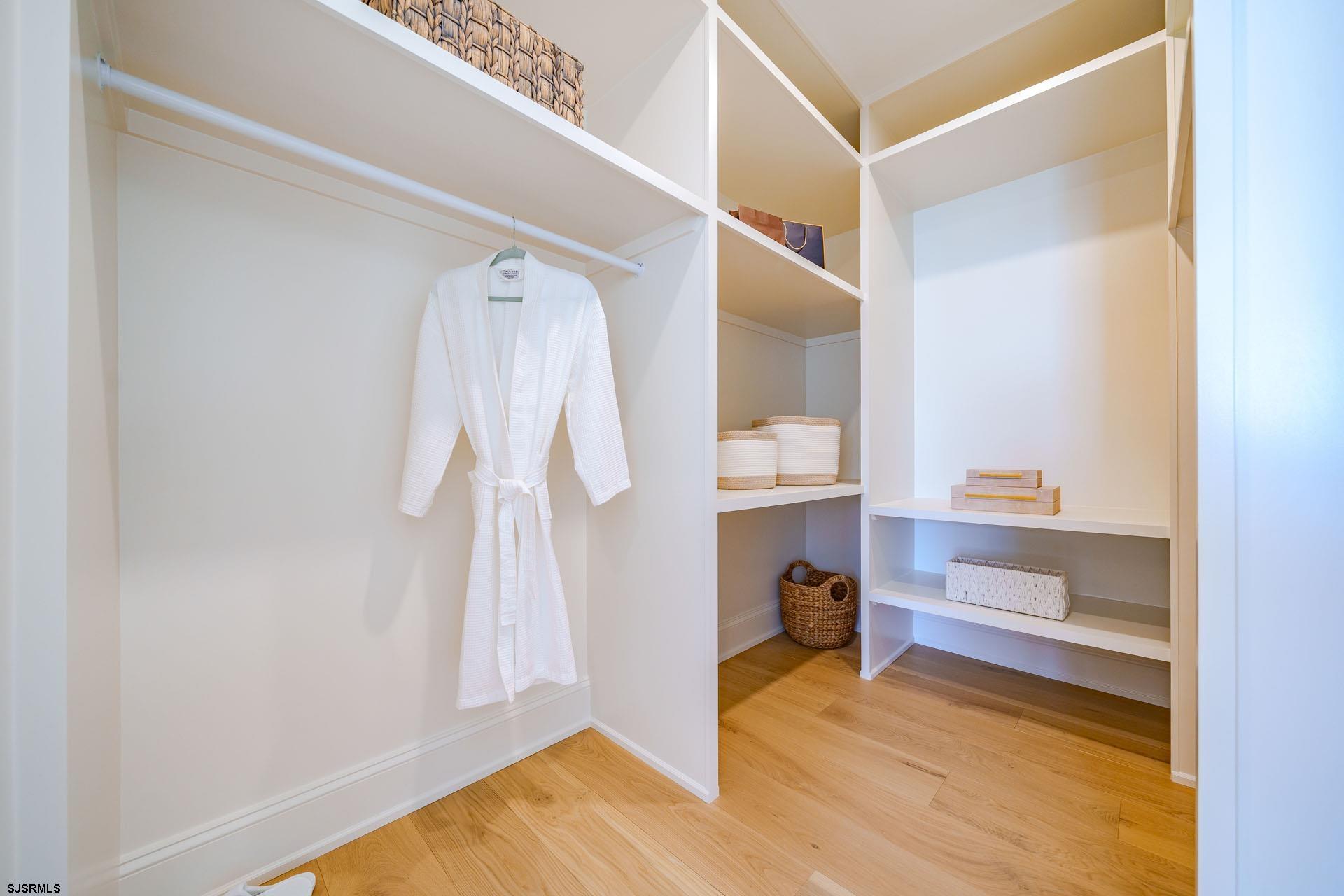 5217 Simpson Avenue Ocean City, NJ 08226 - Photo 12 of 52 a view of walk in closet with clothes and shoes