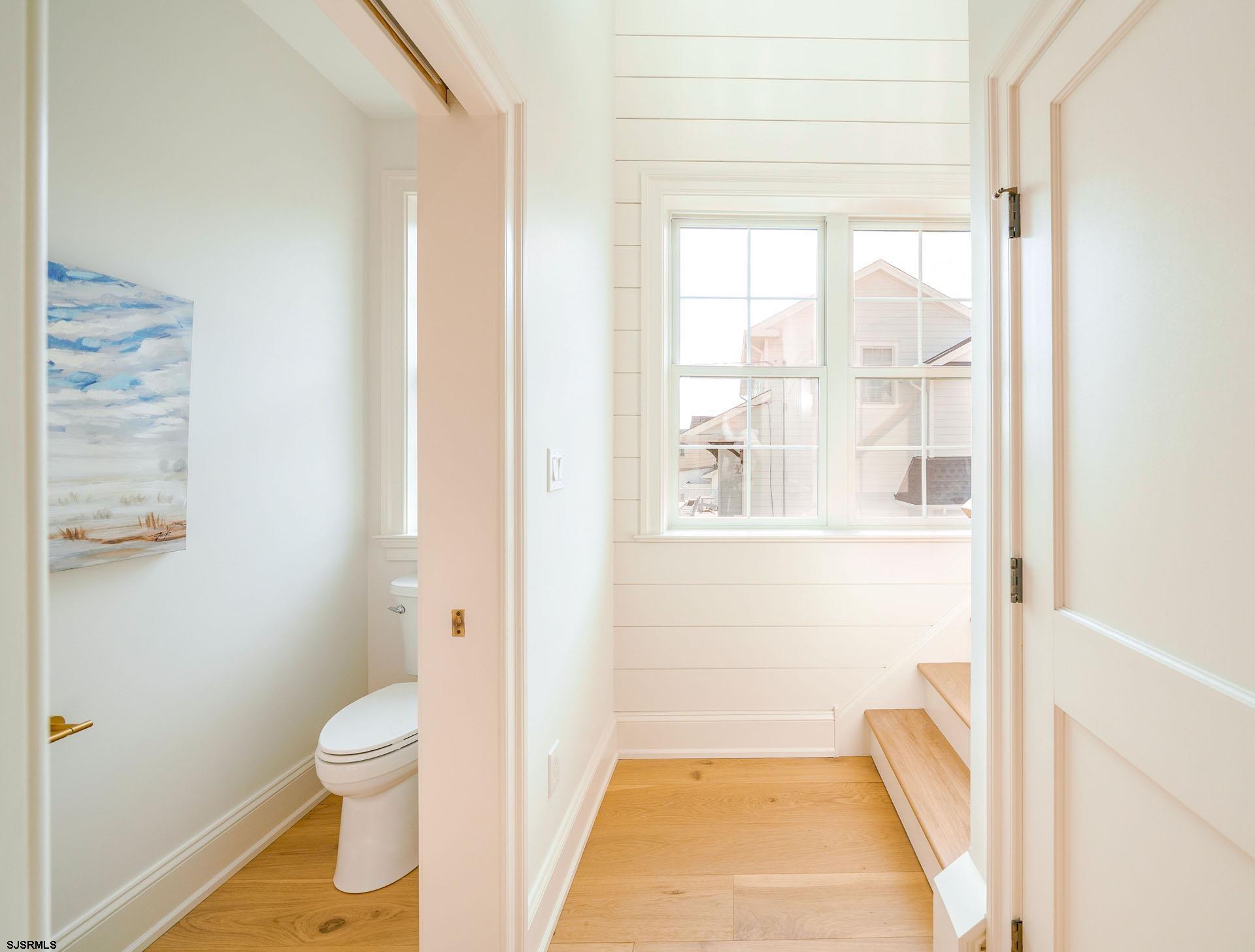 5217 Simpson Avenue Ocean City, NJ 08226 - Photo 17 of 52 a bathroom with a toilet and a shower